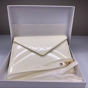 Pandora ivory wrist clutch
